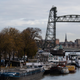 A picture shows barges docked on the Koningshaven waterway as they Koningshavenbrug “De Hef” lift bridge (R, rear) and the Koninginnebrug drawbridge (R, front) are seen in the background in Rotterdam, western Netherlands, on November 23, 2021.